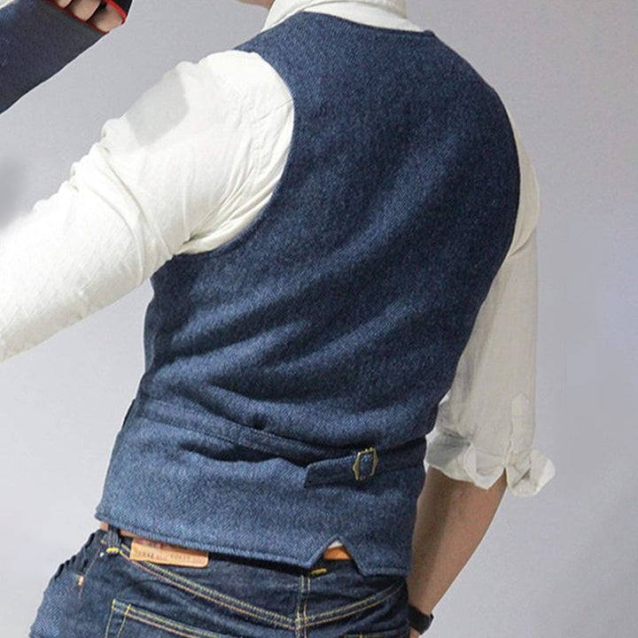 Stylish men's denim vest, perfect for layering over tees or hoodies, adaptable casual wear.