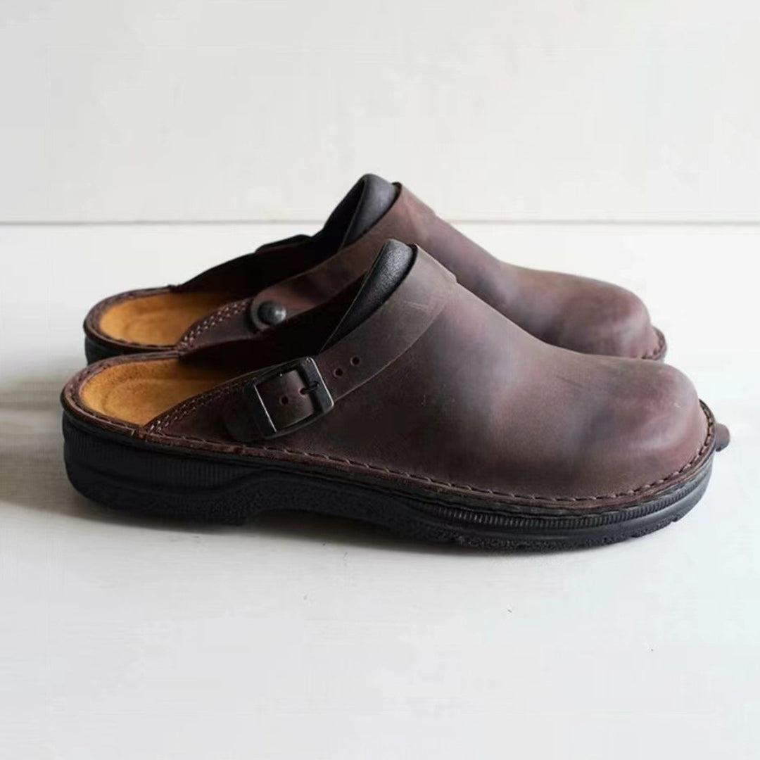 Soft genuine leather men's slip-on comfort slippers, ideal for loungewear or everyday casual indoor shoes.