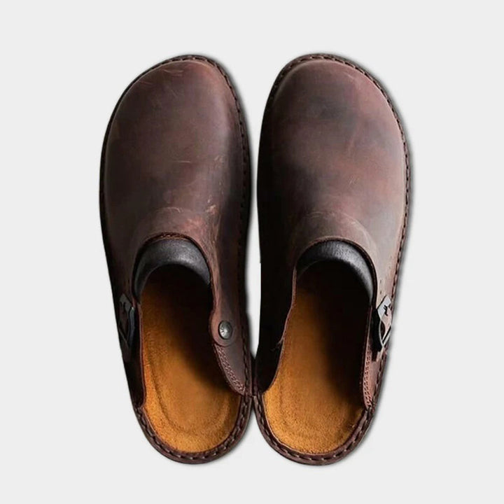 Close-up of Victor men's classic leather slip-on slippers, highlighting quality craftsmanship for everyday comfort.