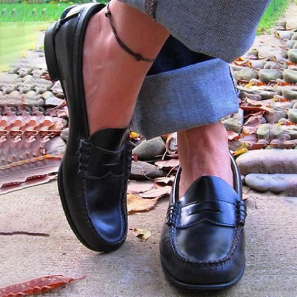Versatile black women's slip-on loafers for professional work & casual everyday style. Comfort flats.