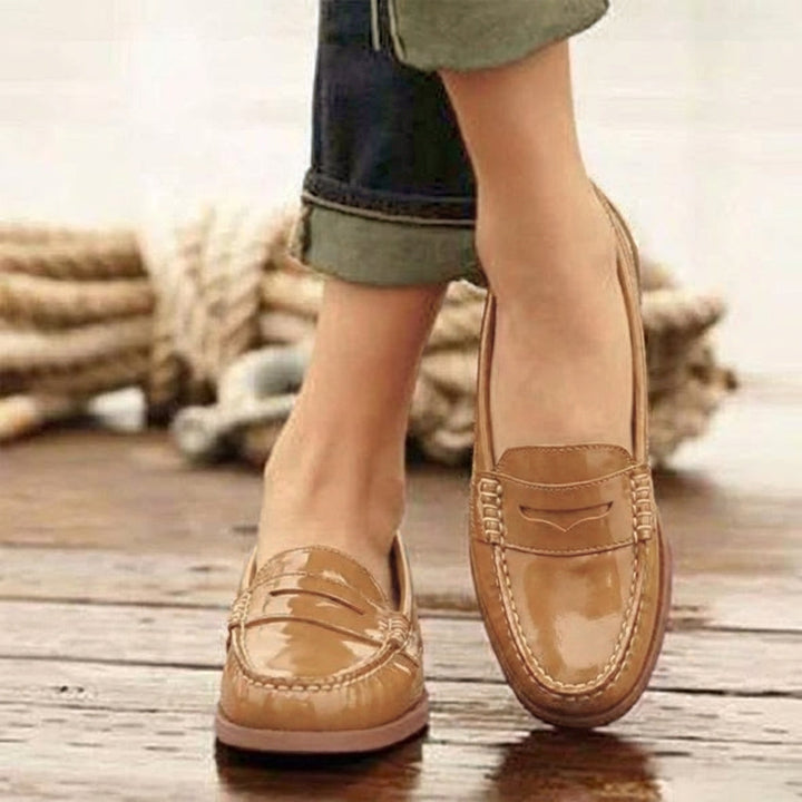 Elegant women's classic slip-on loafers in brown, black & khaki. Chic comfort flats for work & casual.