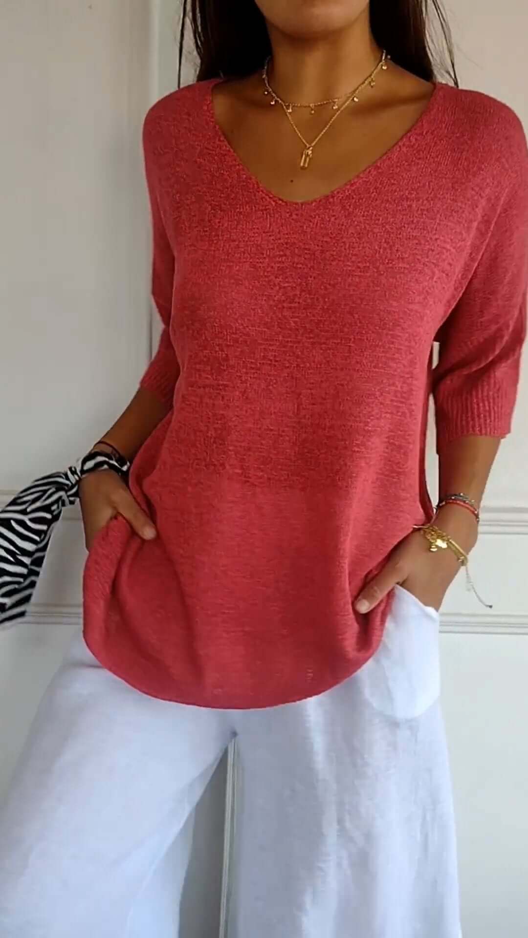 Close-up of a women's soft knit V-neck top in a comfortable, loose fit, ideal for everyday wear.