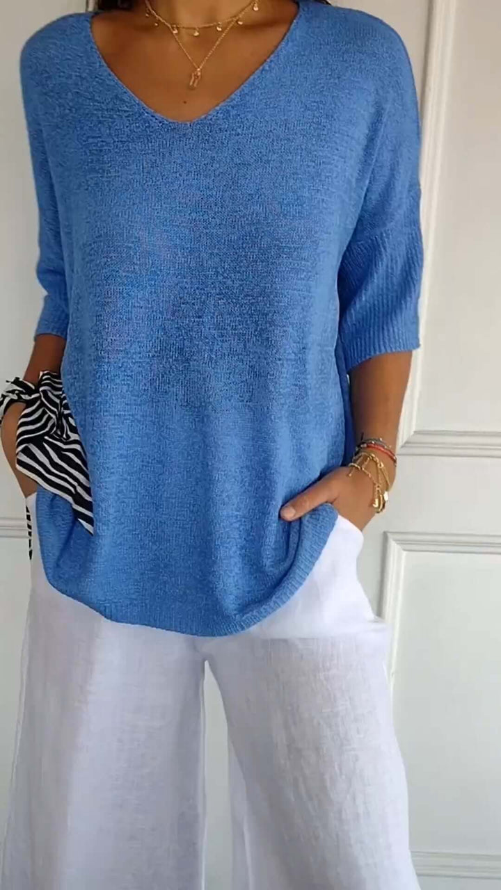 Front view of a women's relaxed fit V-neck knit top, offering ultimate comfort for daily casual wear.