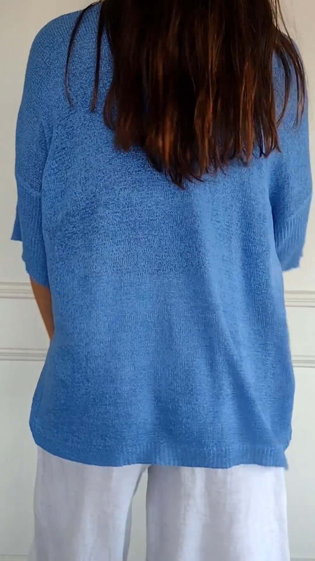 Comfortable women's knitted V-neck top with long sleeves, designed for effortless style and everyday fashion.