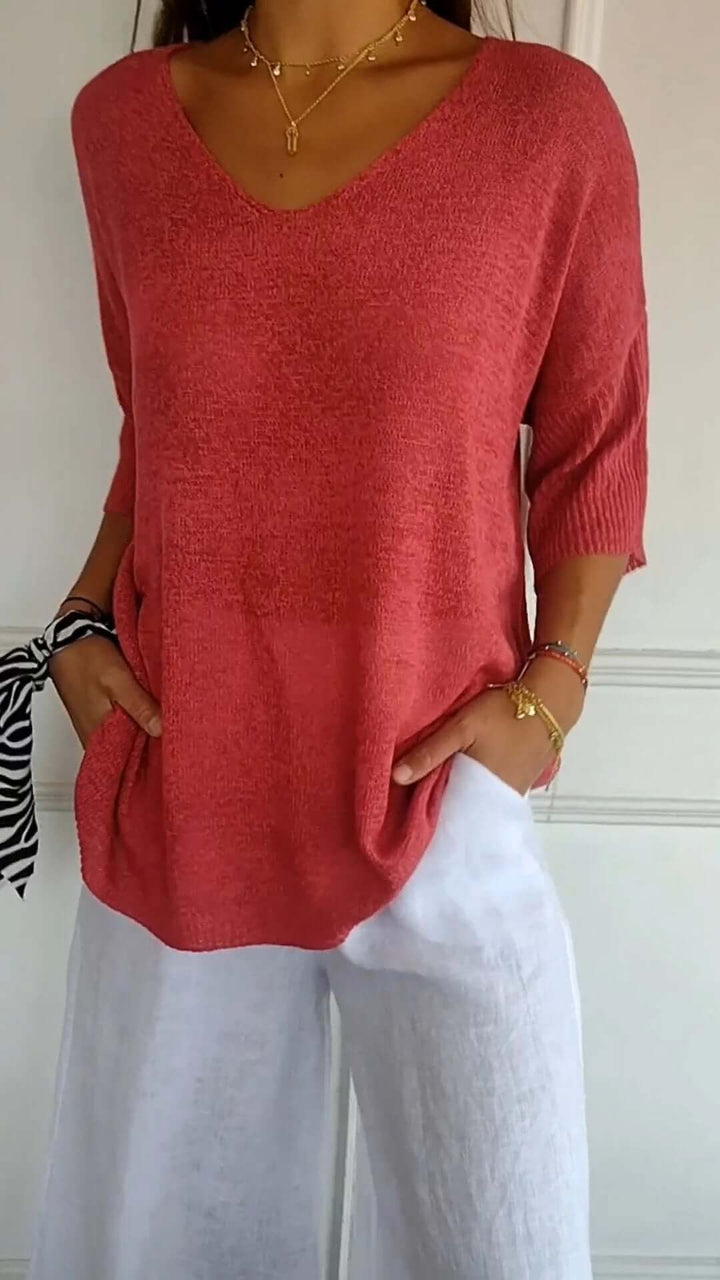 Soft knit V-neck top for women, featuring a loose fit and long sleeves, great for casual, comfortable wear.