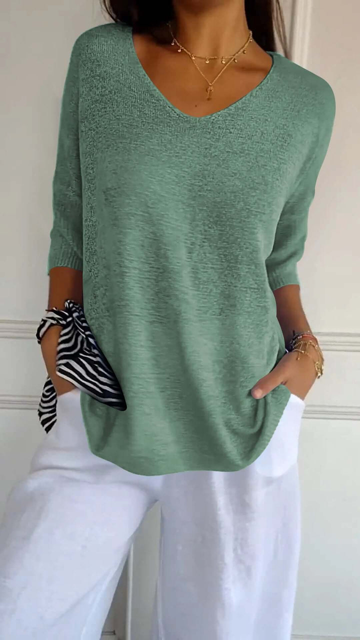 Versatile women's V-neck knit top with a relaxed fit, perfect for everyday comfort and chic casual outfits.