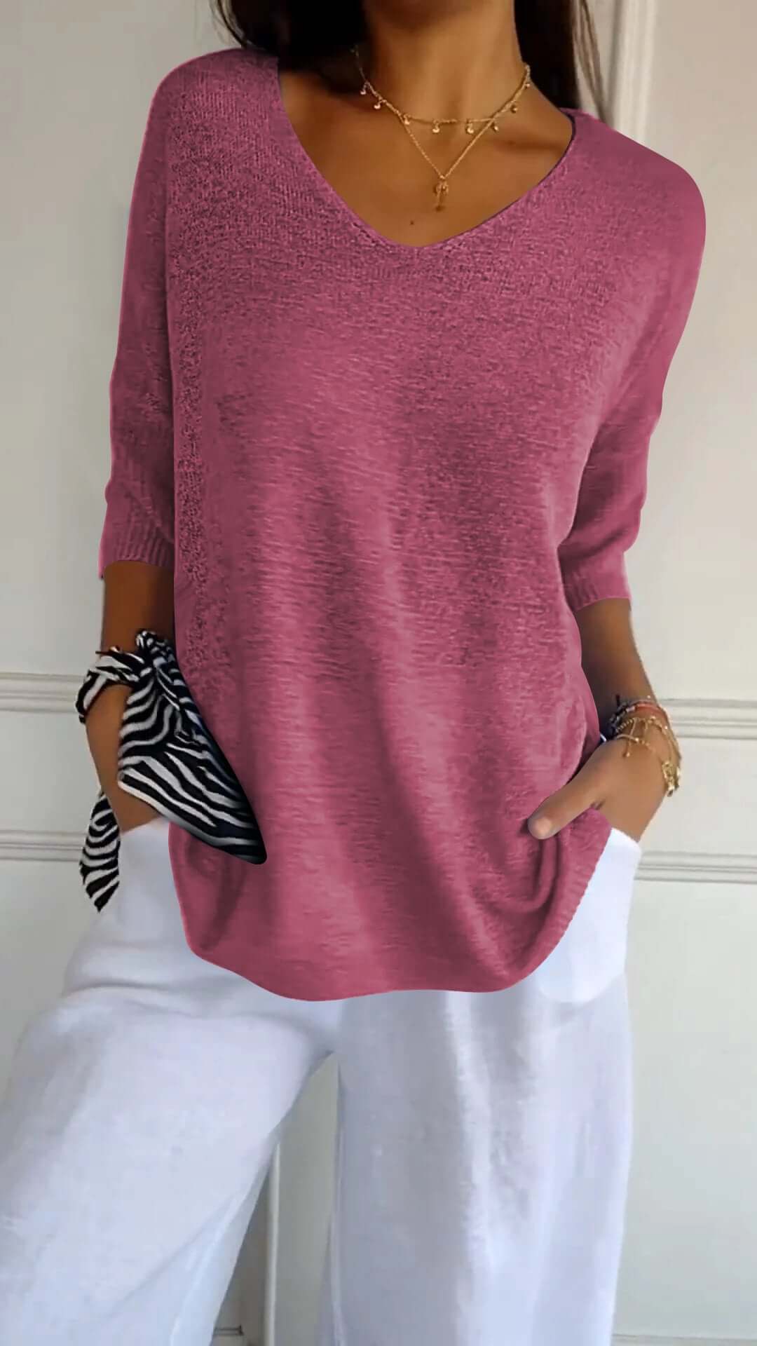 Casual women's V-neck knit top, a long sleeve design in a loose, comfortable fit for stylish everyday wear.