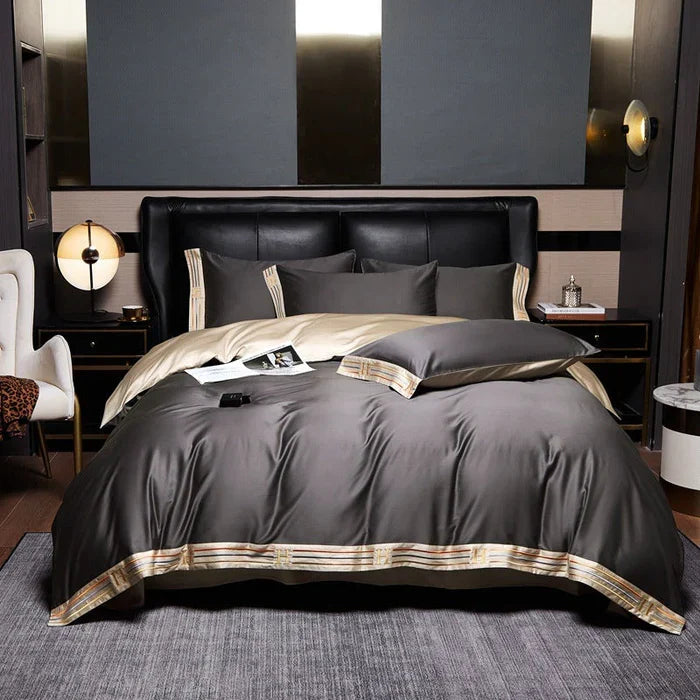 Soft embroidered cotton duvet cover & pillowcases, perfect for a luxurious bedroom aesthetic.