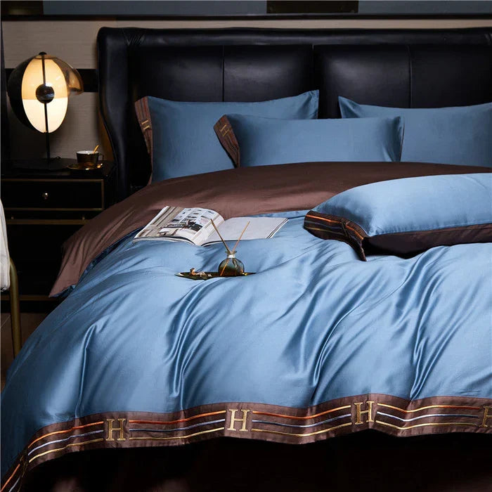 All-season embroidered cotton duvet cover & pillow shams, soft twill weave for blissful sleep.