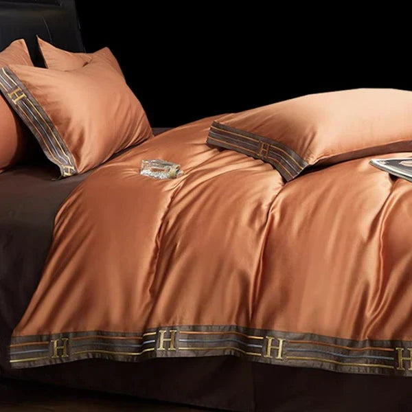 Cozy embroidered cotton bedding, featuring a beautiful duvet cover & pillowcases, comfort assured.