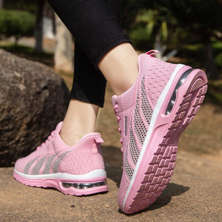 Pair of women's platform running shoes in a vibrant color. Durable design for outdoor training and comfort.