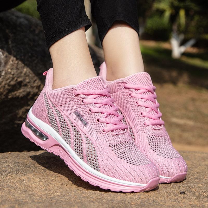 Side view of women's platform training shoes with thick sole. Built for stability during outdoor workouts.