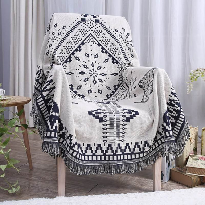 "Colorful bohemian tassel knitted sofa throw, featuring bright patterns and ethnic tassel details for vibrant home decor."