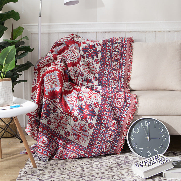 "Colorful bohemian tassel knitted sofa throw, featuring bright patterns and ethnic tassel details for vibrant home decor."