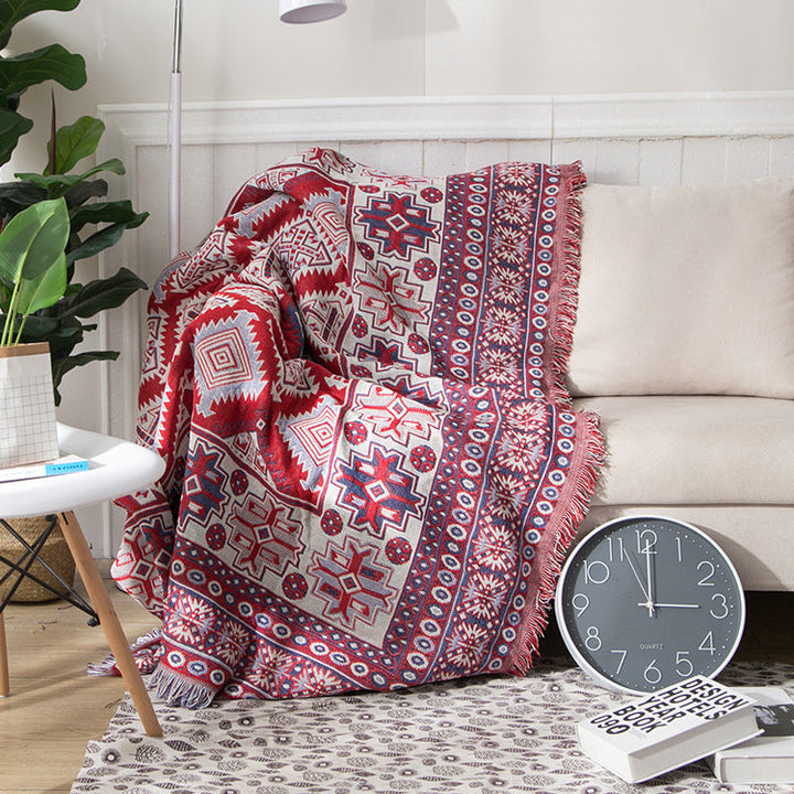 "Colorful bohemian tassel knitted sofa throw, featuring bright patterns and ethnic tassel details for vibrant home decor."