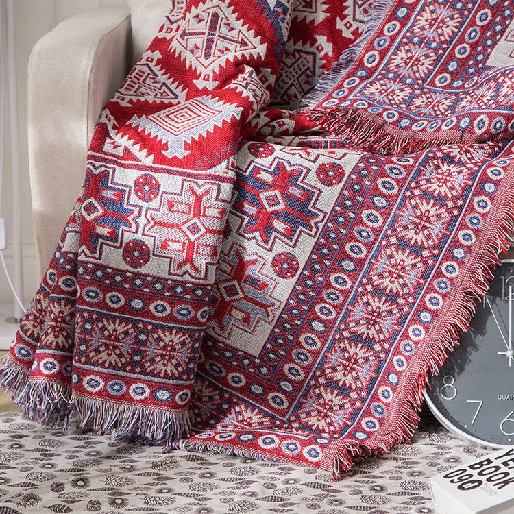 "Colorful bohemian tassel knitted sofa throw, featuring bright patterns and ethnic tassel details for vibrant home decor."