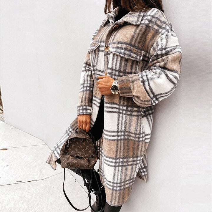 Elegant women's long plaid coat. Comfortable and warm checked winter outerwear for stylish fashion.
