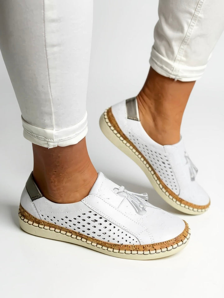 Stylish women's tassel loafers; comfortable slip-on flats offering sophisticated and casual elegance footwear.