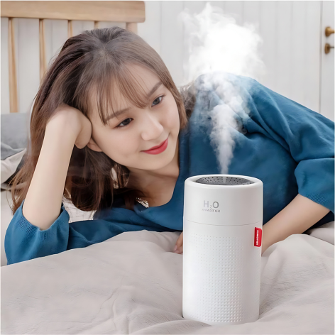 Compact blue and white portable rechargeable humidifier, enhancing air moisture, perfect for travel and home use.