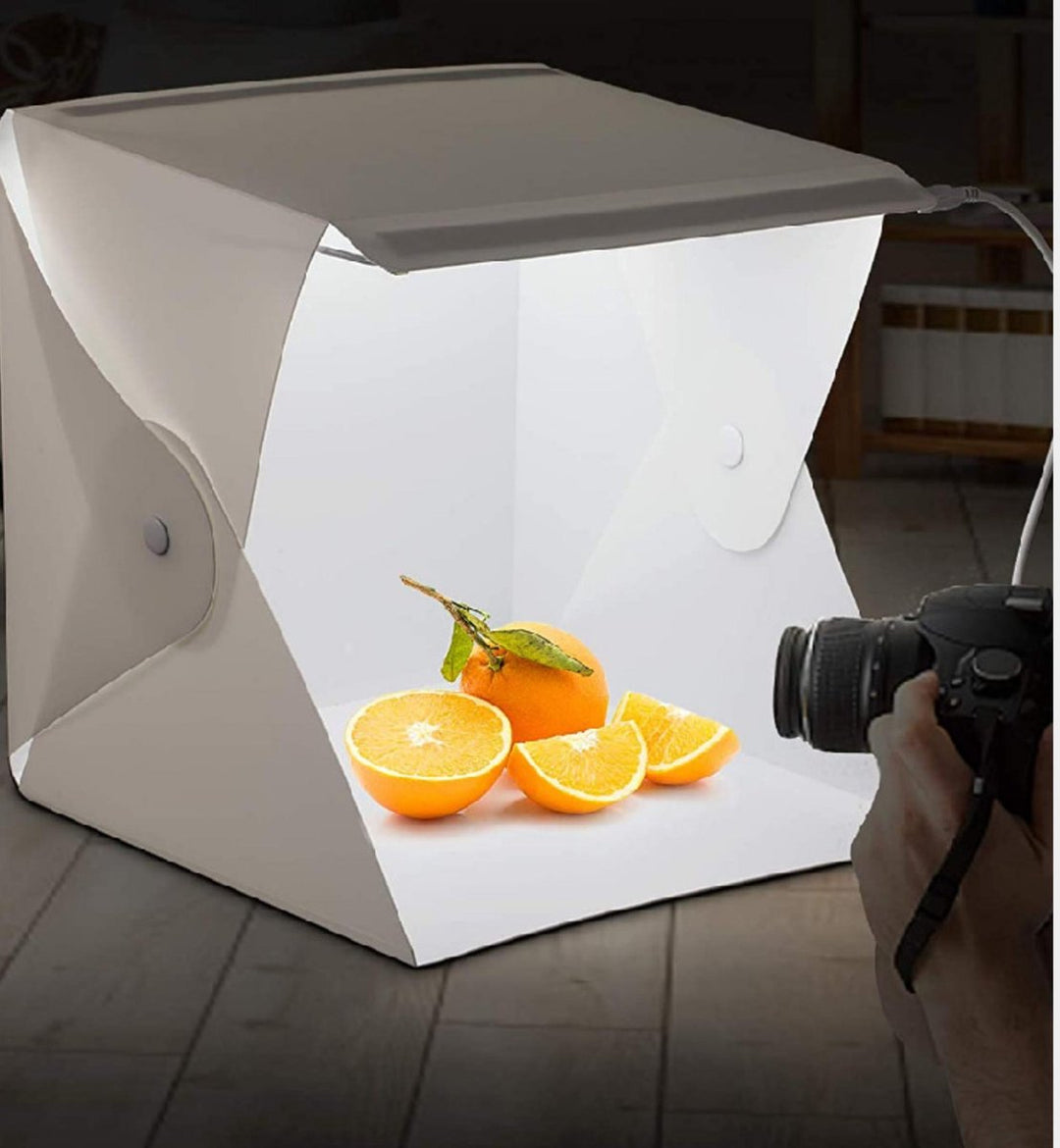 Compact portable LED photography light box studio kit for professional product photos.