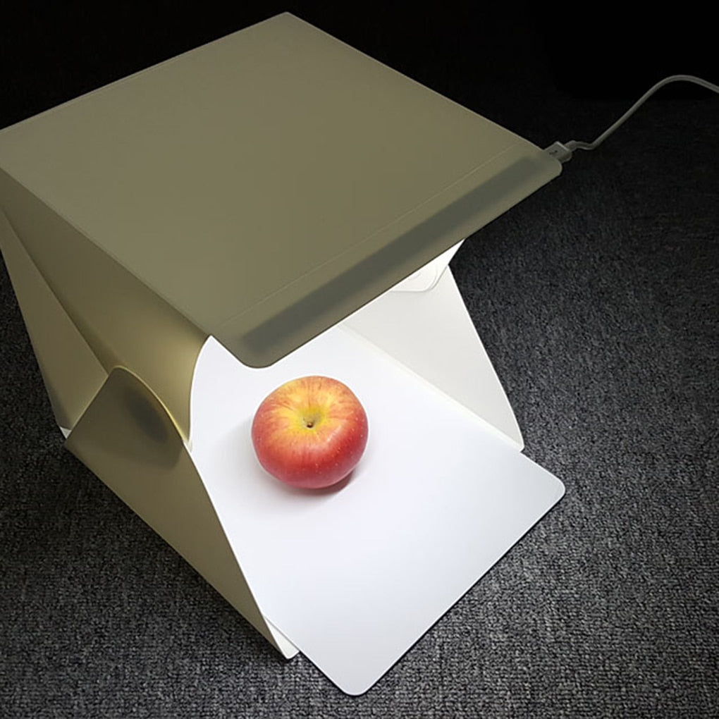 USB-powered tabletop photo tent studio with LED lighting, ideal for product photography.