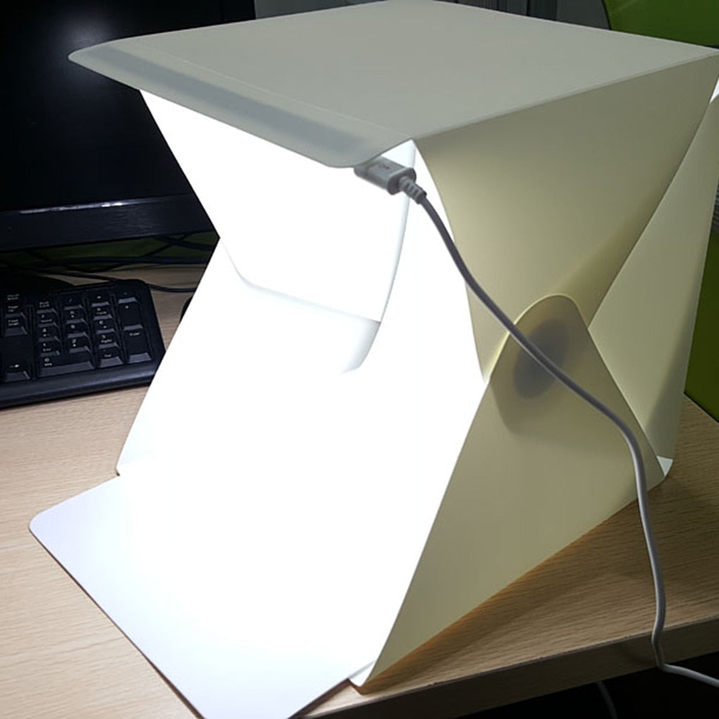 Compact photography light box tent, USB powered, for high-quality tabletop product photos.