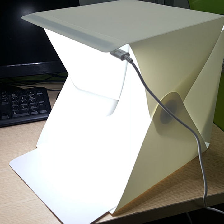 Compact photography light box tent, USB powered, for high-quality tabletop product photos.