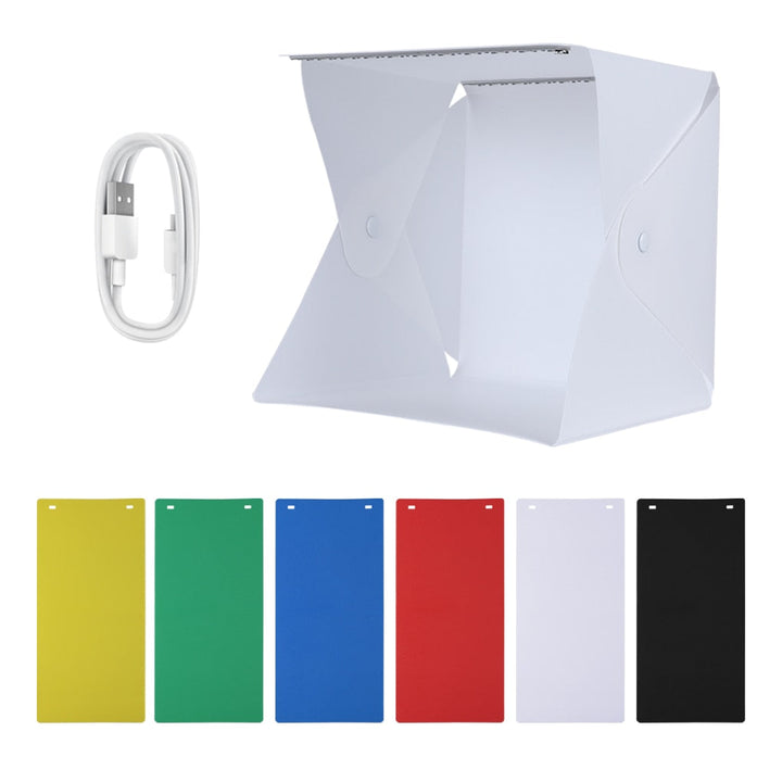 Photography light box studio, compact and portable, with bright LED lighting for product shots.