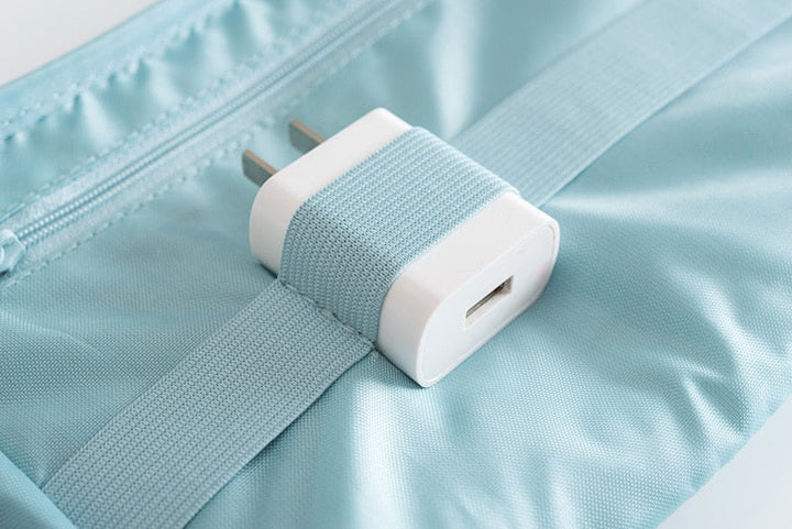 Smart cable management solution: waterproof electronics organizer for travel.