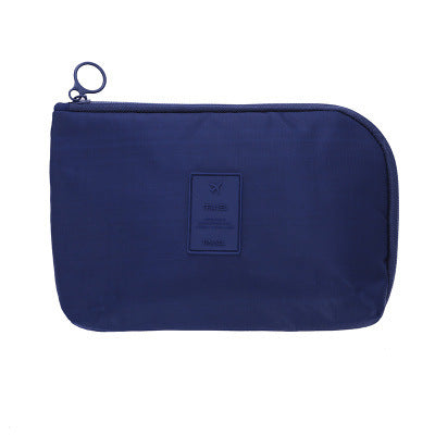 Unisex waterproof tech accessory bag for ultimate cable management on the go.