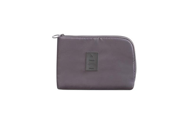 Durable waterproof travel organizer for chargers, cables, and power banks.