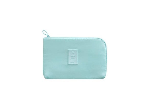 Compact travel electronics storage case, keeping your cables neat & dry.
