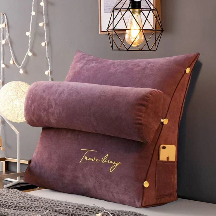 Contoured wedge pillow with ergonomic design, offering back support and a soft fabric cover for comfort and pressure relief.