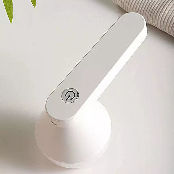 Cordless lint remover efficiently cleans sweaters & clothing, removing pills & fuzz for garment care.