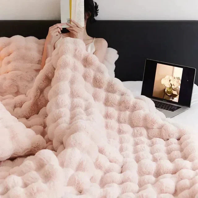 Elegant faux fur blanket, a cozy home decor accent providing warmth & comfort.