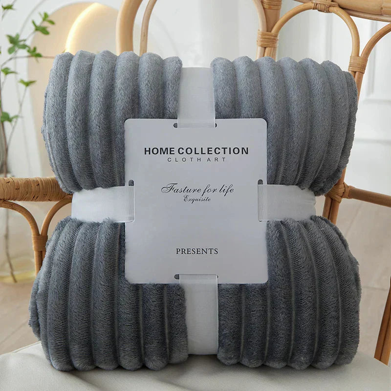 Cozy plush wide-stripe fleece throw blanket in a neutral tone, perfect for living room comfort & warmth.