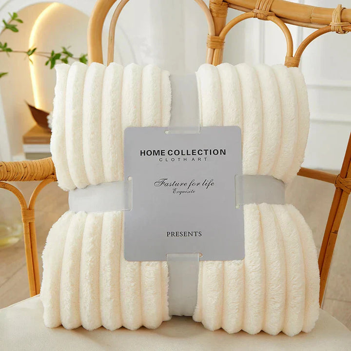 Elegant wide-stripe fleece blanket, a soft & warm throw, enhancing comfort and home decor in any room.