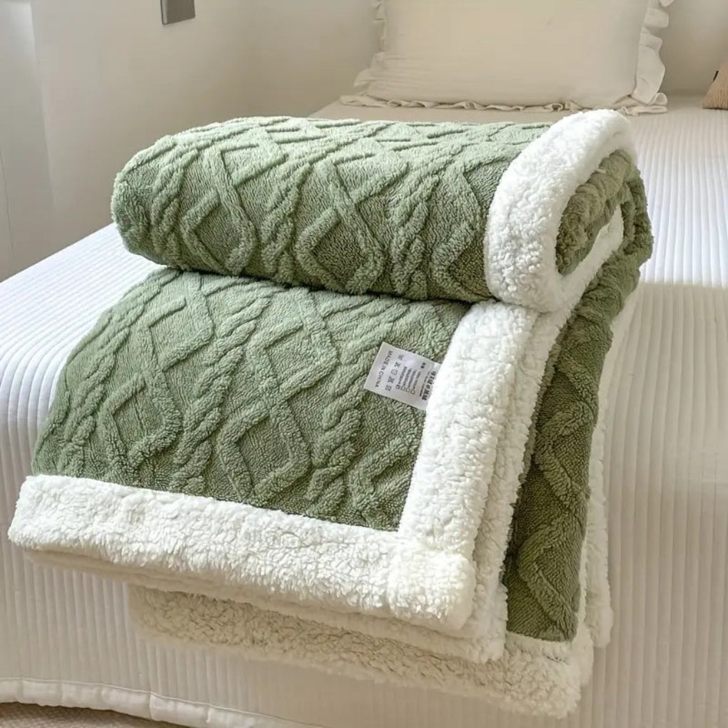 Reversible diamond knit sherpa throw blanket, ideal for luxurious comfort and stylish home decor in any living room.