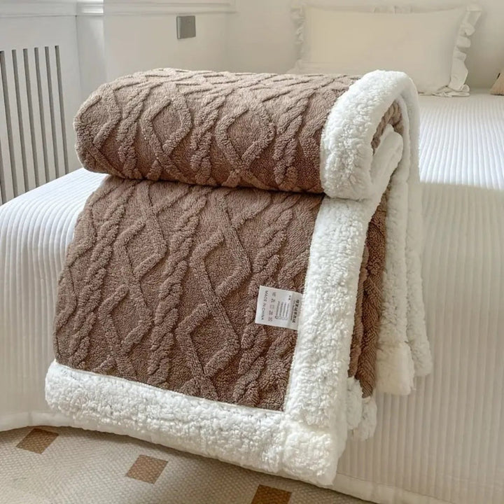 Warm and fuzzy unisex sherpa blanket with elegant diamond knit, offering ultimate cozy comfort for any home.