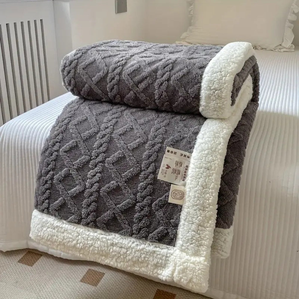 Cozy reversible diamond knit sherpa blanket, providing ultimate softness, warmth, and stylish comfort for your home.