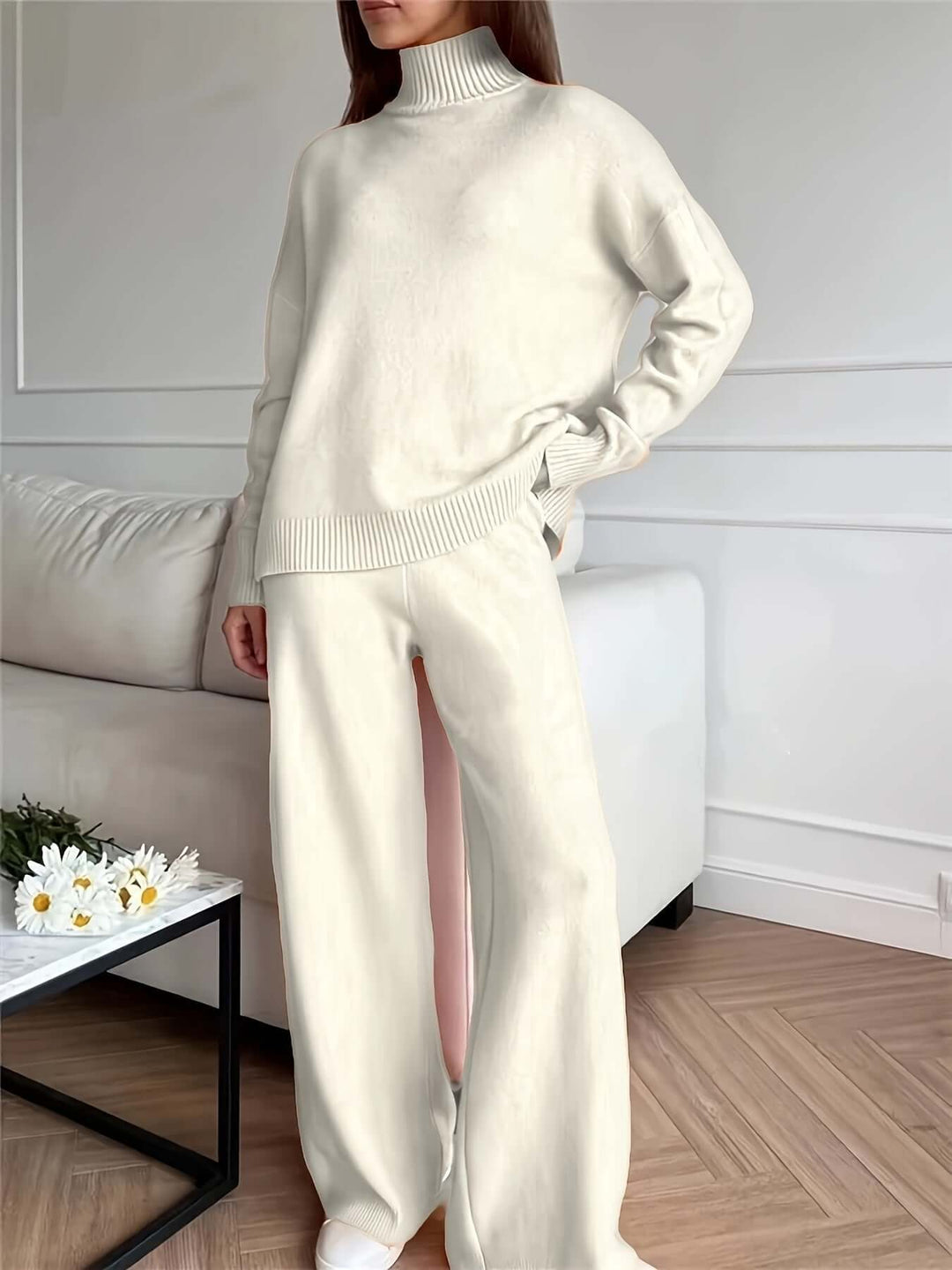 Stylish women's white knitted turtleneck sweater & pants set. Versatile autumn & winter cozy fashion two-piece.
