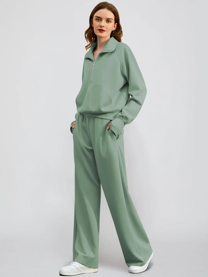 Cozy women's half-zip sweatshirt and wide-leg pant lounge set. Relaxed fit two-piece loungewear.