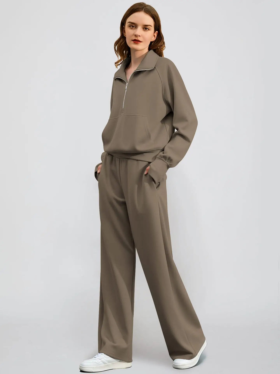 Casual women's half-zip top and wide-leg pant two-piece outfit. Stylish and comfortable leisure set.