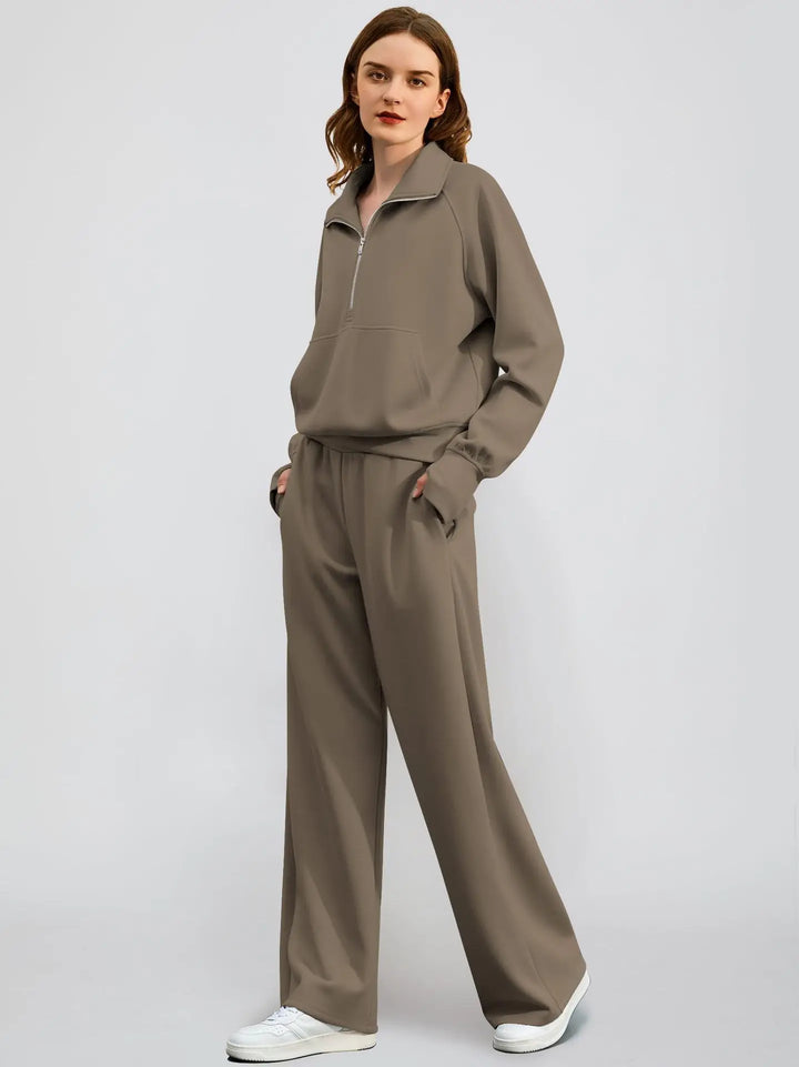 Casual women's half-zip top and wide-leg pant two-piece outfit. Stylish and comfortable leisure set.