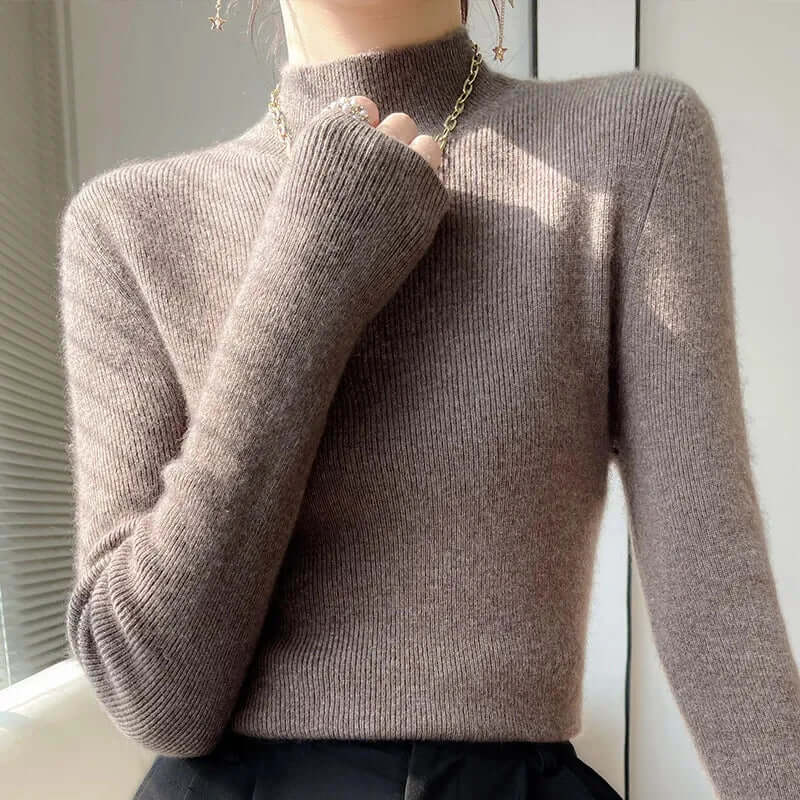 Ribbed knit women's long sleeve sweater with a half turtleneck, offering ultimate comfort.