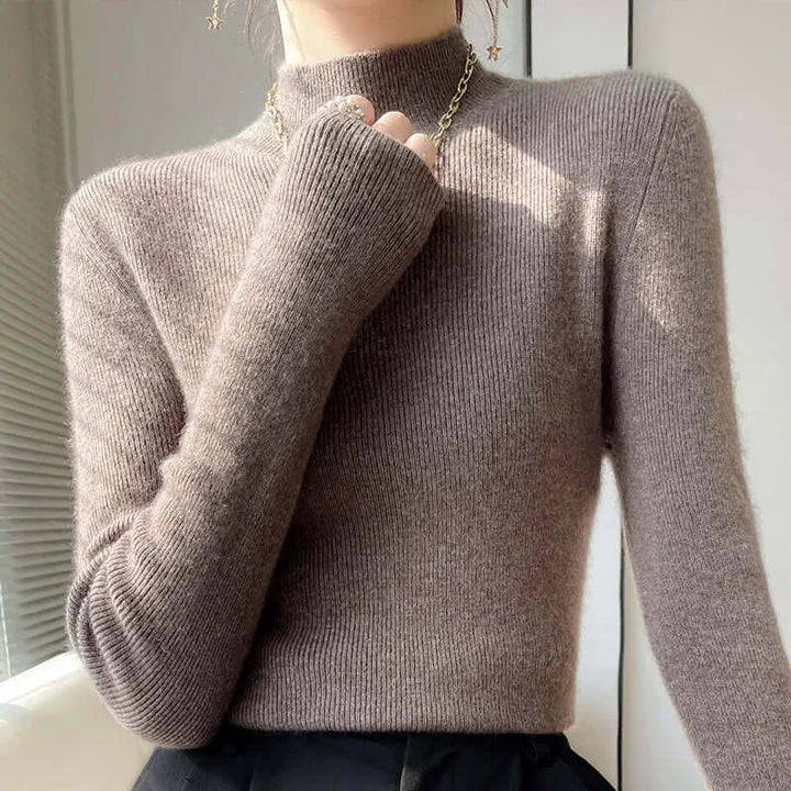 Ribbed knit women's long sleeve sweater with a half turtleneck, offering ultimate comfort.