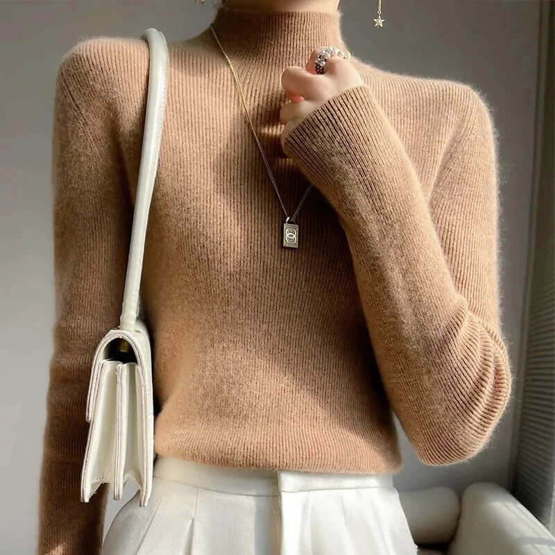Long sleeve women's knitted pullover with a cozy half turtleneck, ideal for layering.