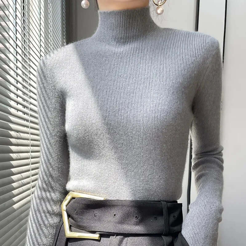 Soft knit women's sweater with a comfortable half turtleneck, a must-have for fall style.