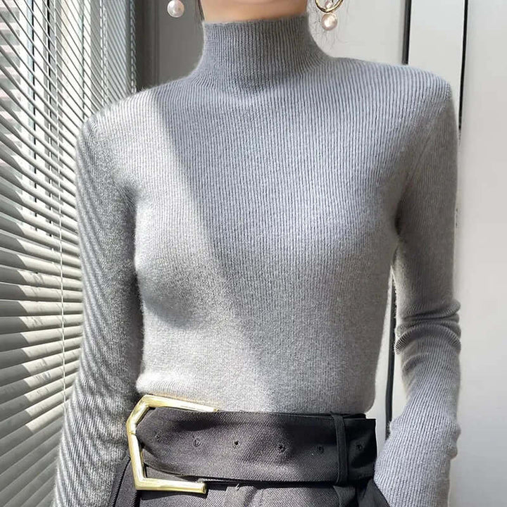 Soft knit women's sweater with a comfortable half turtleneck, a must-have for fall style.