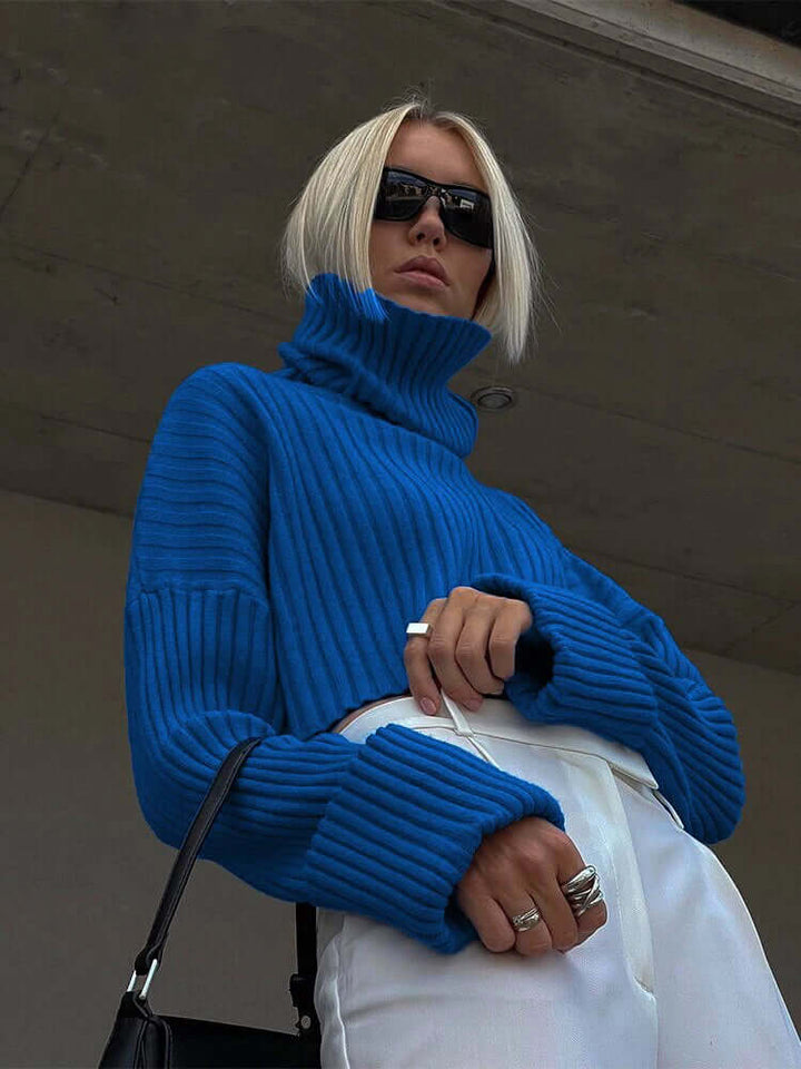 Cozy women's knitted pullover sweater for winter. Stylish long sleeve design, perfect for warmth and comfort.